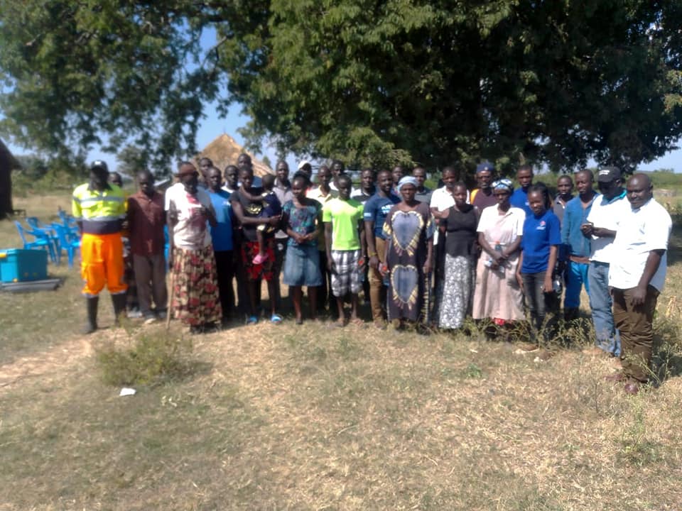 Large group of farming community members served by GreatLakes Feeds, gathered outdoors